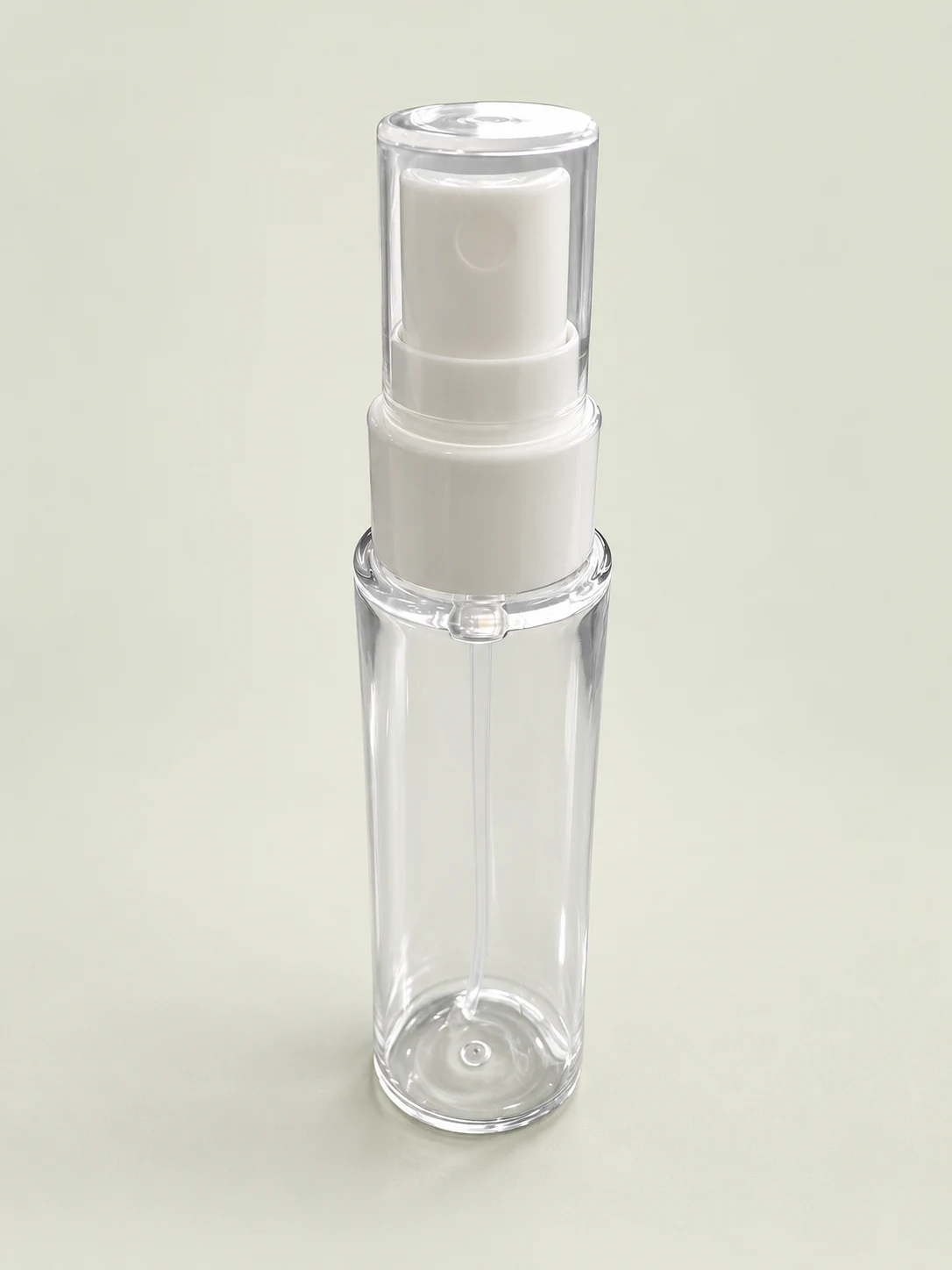 Close-up of white sprayer and clear overcap mounted on a clear bottle